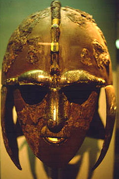 The famous parade helmet found at Sutton Hoo, probably belonging to Raedwald of East Anglia circa 625. Based on a Roman parade-helmet design (of a general class known as spangenhelm), it has decorations like those found in contemporary Swedish helmets found at Old Uppsala (Collection of the British Museum)